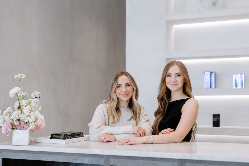 Providers at Honey Aesthetics smile in their modern office, where they provide filler for nasolabial folds in Woodbury.
